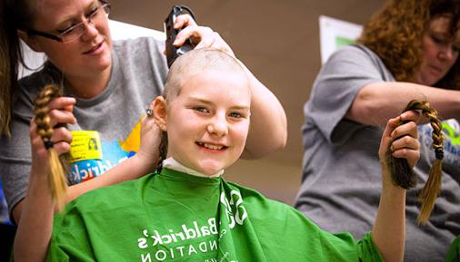 Volunteer getting head shaved at St. Baldrick's event